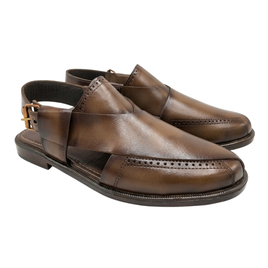 Pair of brown leather shoes on a white background