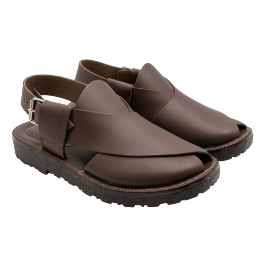 Pair of brown leather sandals on a white background