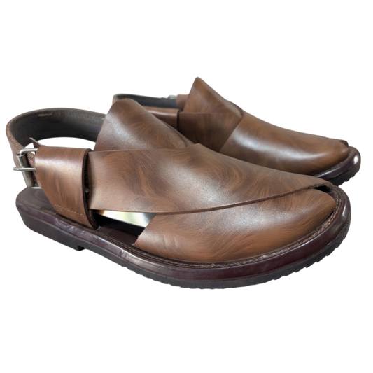 Pair of brown leather shoes on a white background