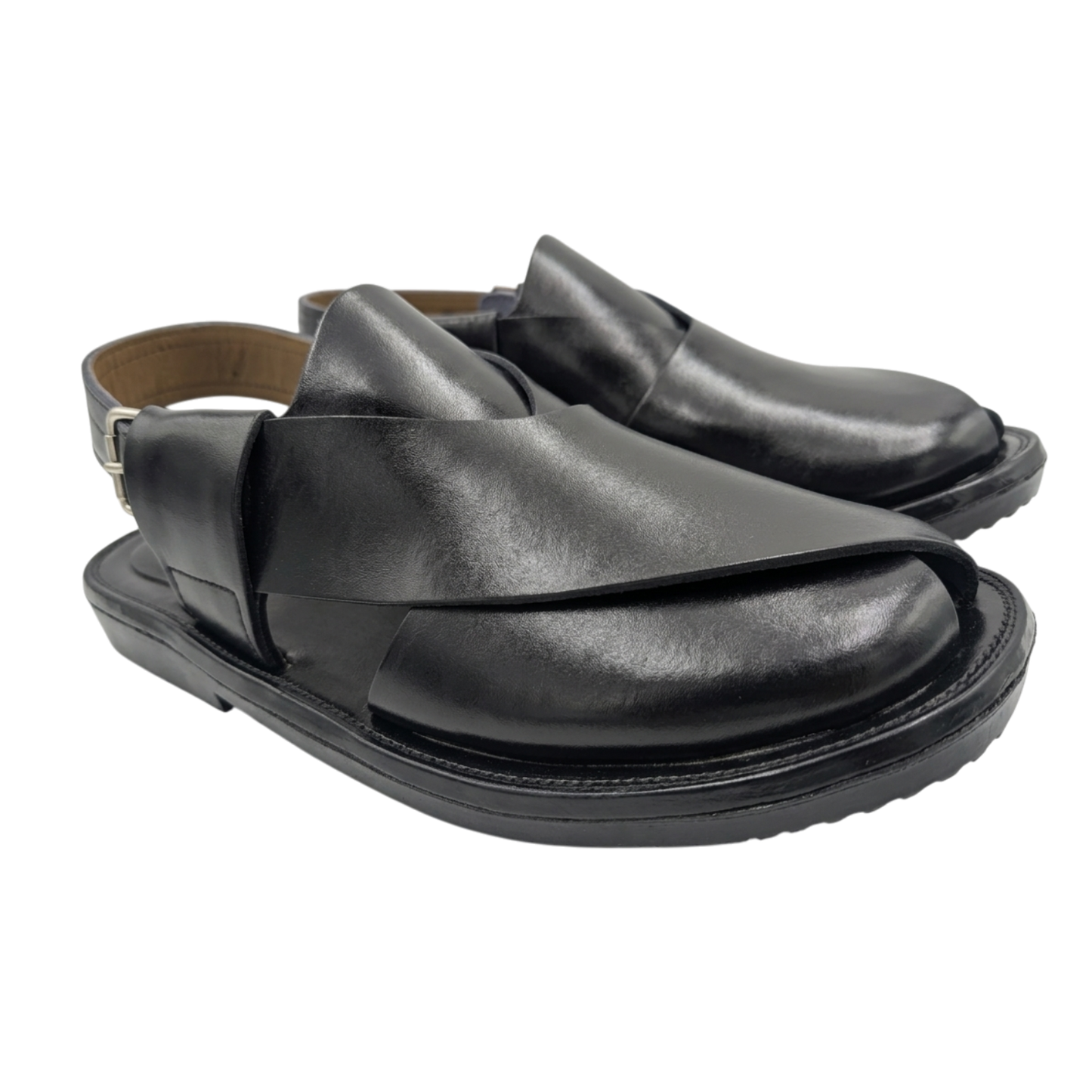 Pair of black leather sandals on a white background