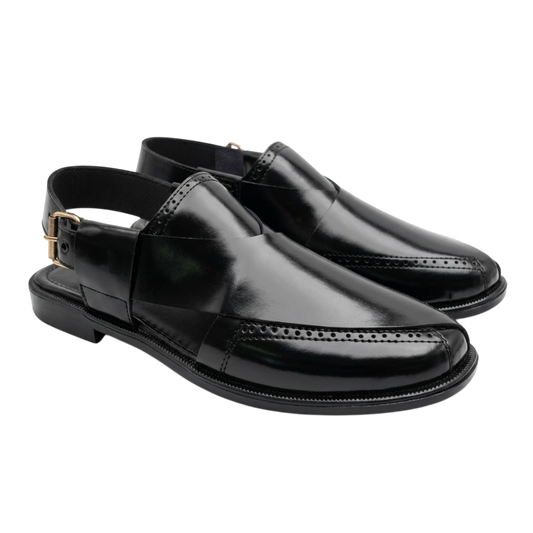 Pair of black leather shoes on a white background