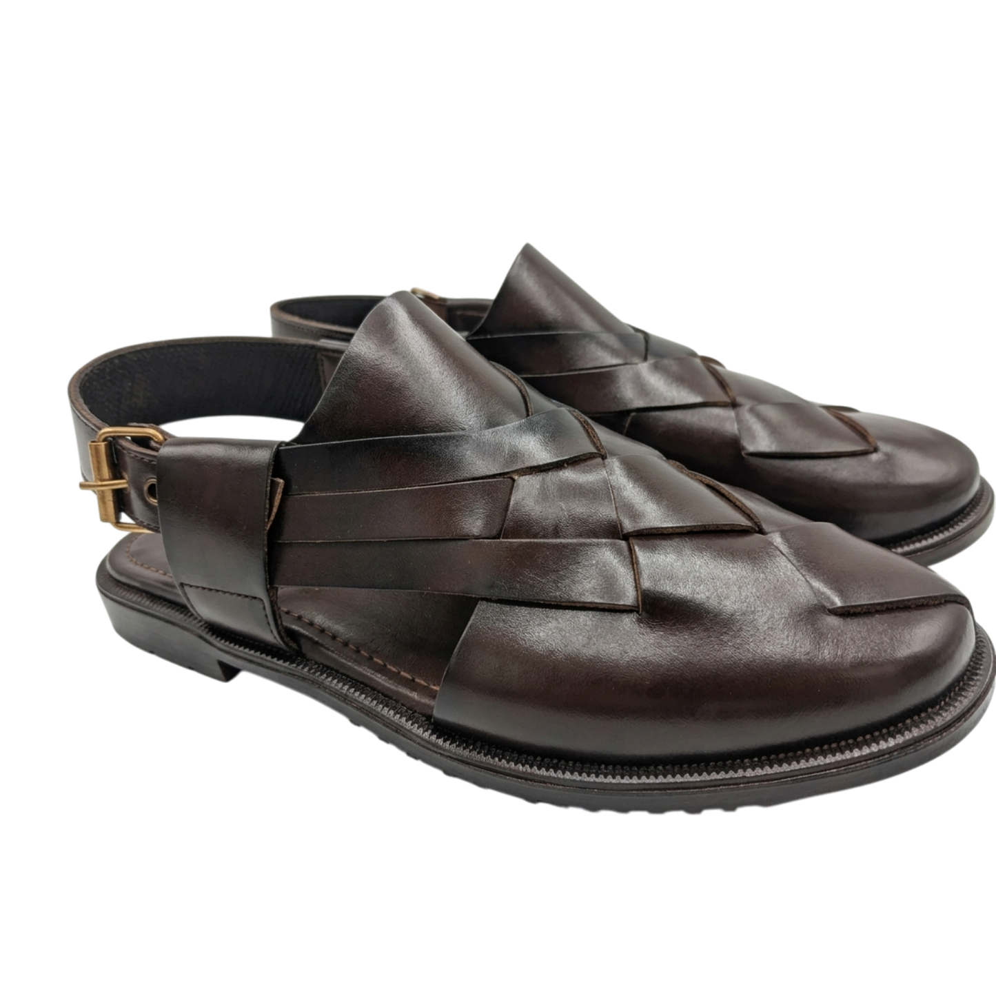 Pair of brown woven sandals on a white background