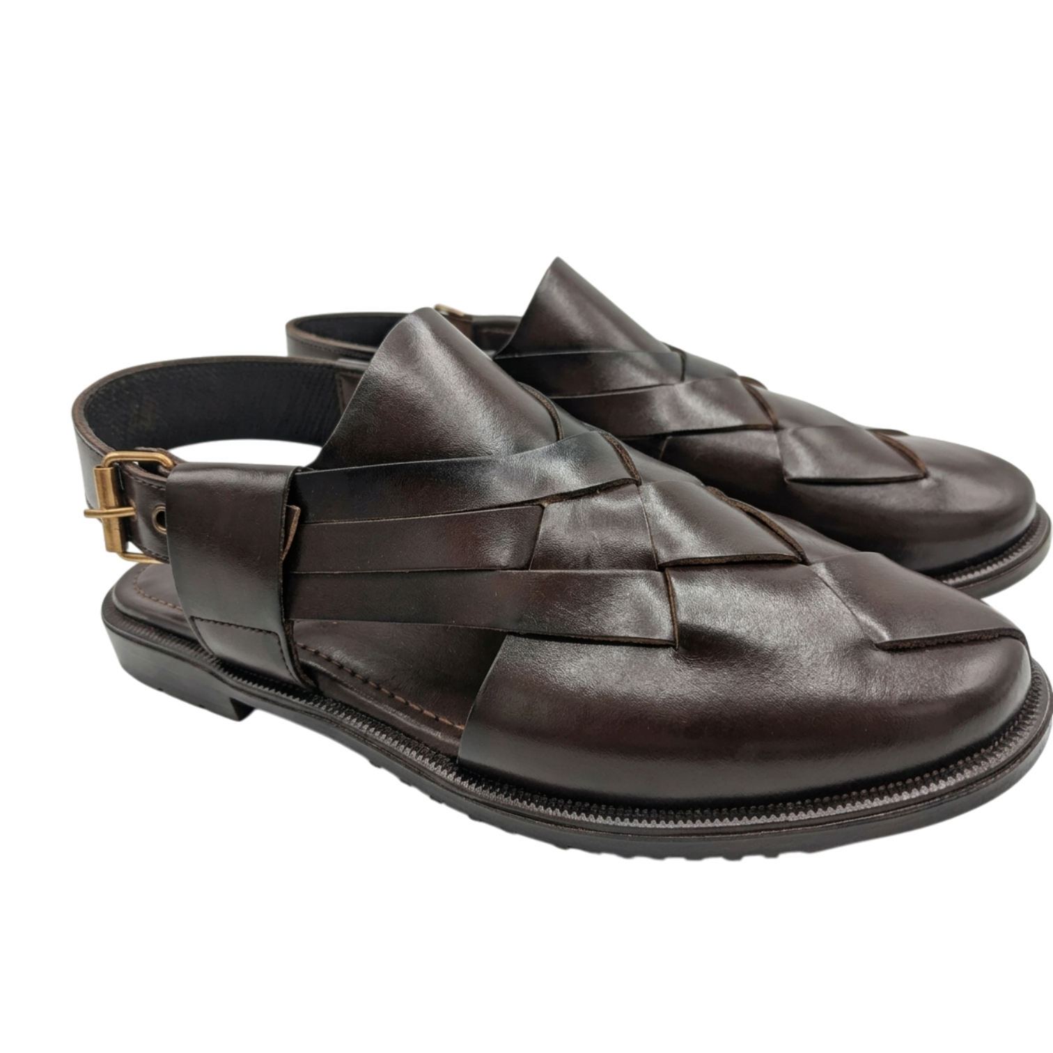 Pair of brown woven sandals on a white background