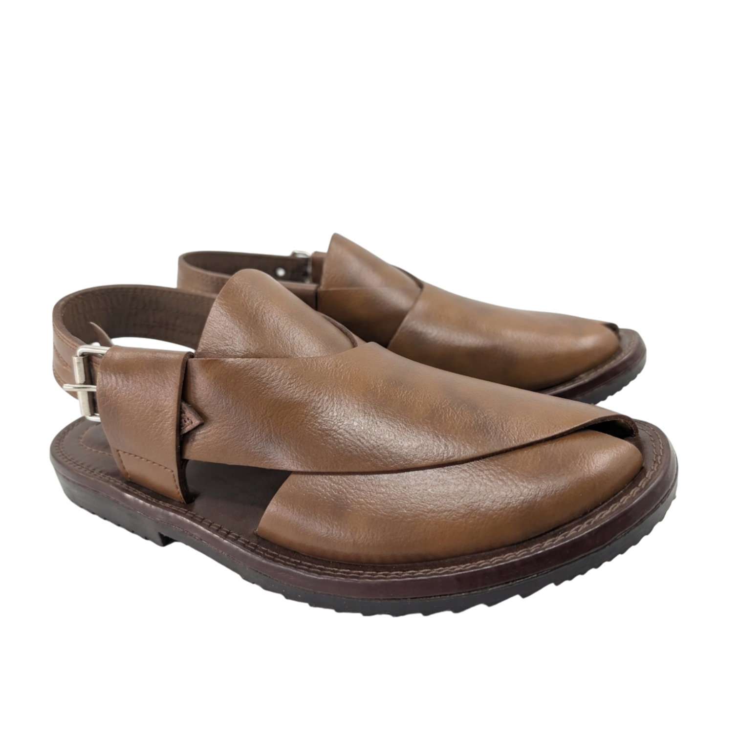Pair of brown leather sandals on a white background