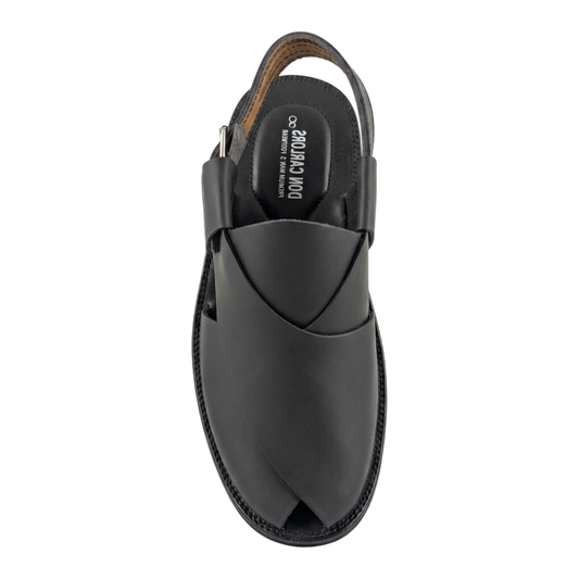 Black sandal with a unique design on a white background