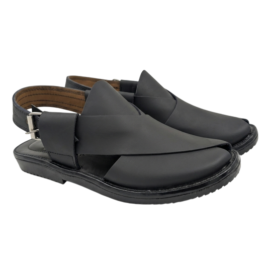 Black sandal with criss-cross straps on a white background