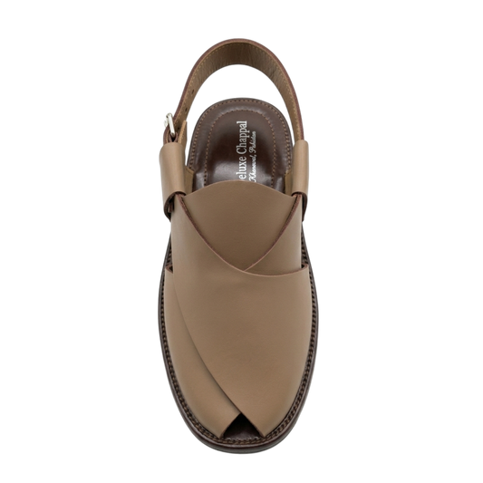 Brown sandal with a slingback design on a white background